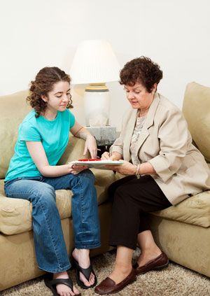 Girl-signing-documents-with-mother-300x