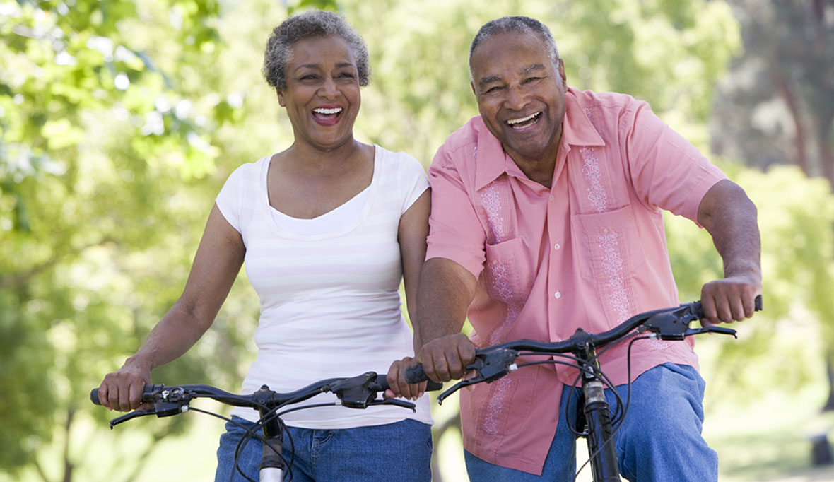 Smiling senior couple on bicycles